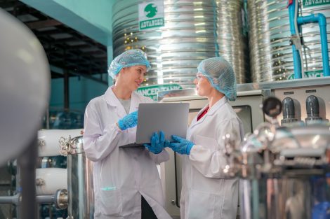 female-worker-inspecting-water-bottle-on-productio-2025-02-03-09-53-02-utc